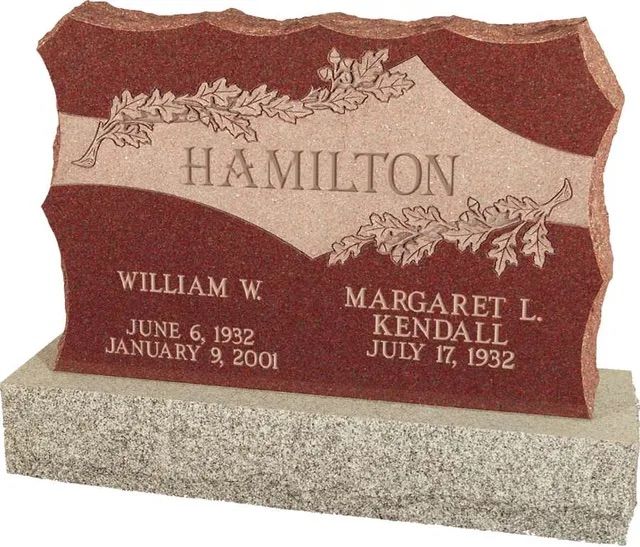Red and gray Hamilton gravestone with names William W. and Margaret L. Kendall and dates engraved.