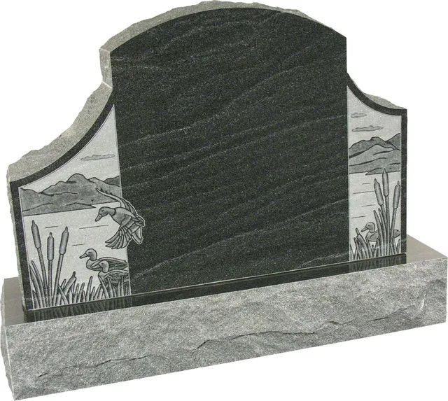 Black upright headstone with engraved desert scene on a gray base