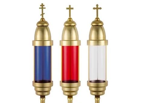 Three gold-capped candle holders with blue, red, and white glass centers