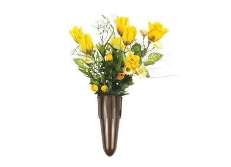 Yellow flowers in a brown wall-mounted vase arrangement