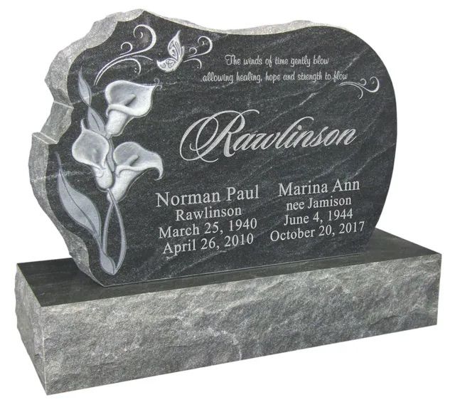 Black granite memorial headstone with white floral engraving and the name “Rawlinson” on a base