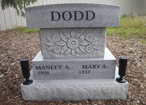 DODD family gravestone with floral carving and memorial plaques for Manley A. and Mary L.