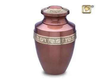 Decorative pink and brown urn with gold band and ornate lid