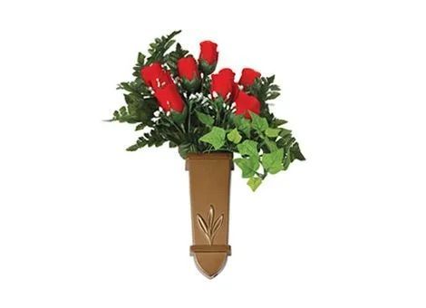 Brown wall-mounted vase with red roses and green foliage