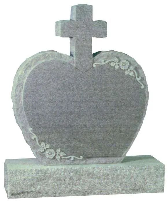 Gray heart-shaped tombstone with a cross on top and floral carvings on the base