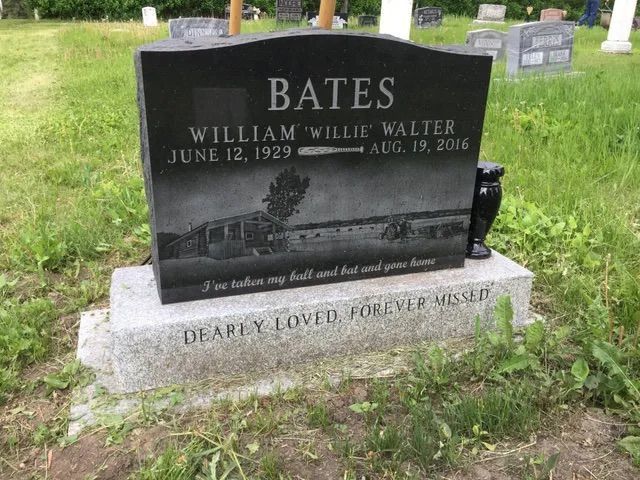 Black headstone for William 'Willie' Walter Bates (1929-2016) with engraved car image and text