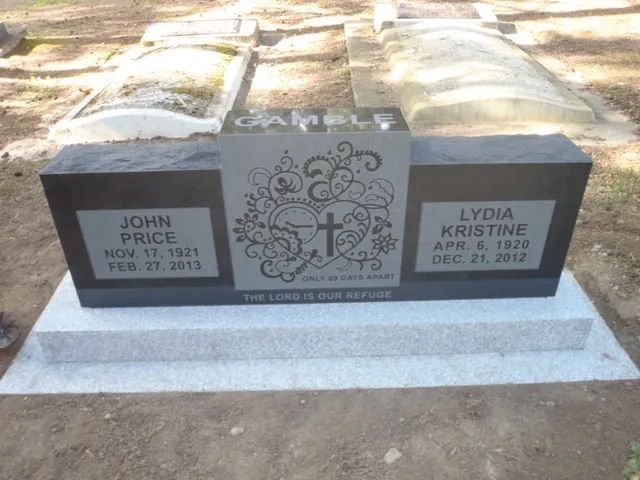 Gravestone with two plaques and a central cross, honoring John and Lydia Kristine in a cemetery.