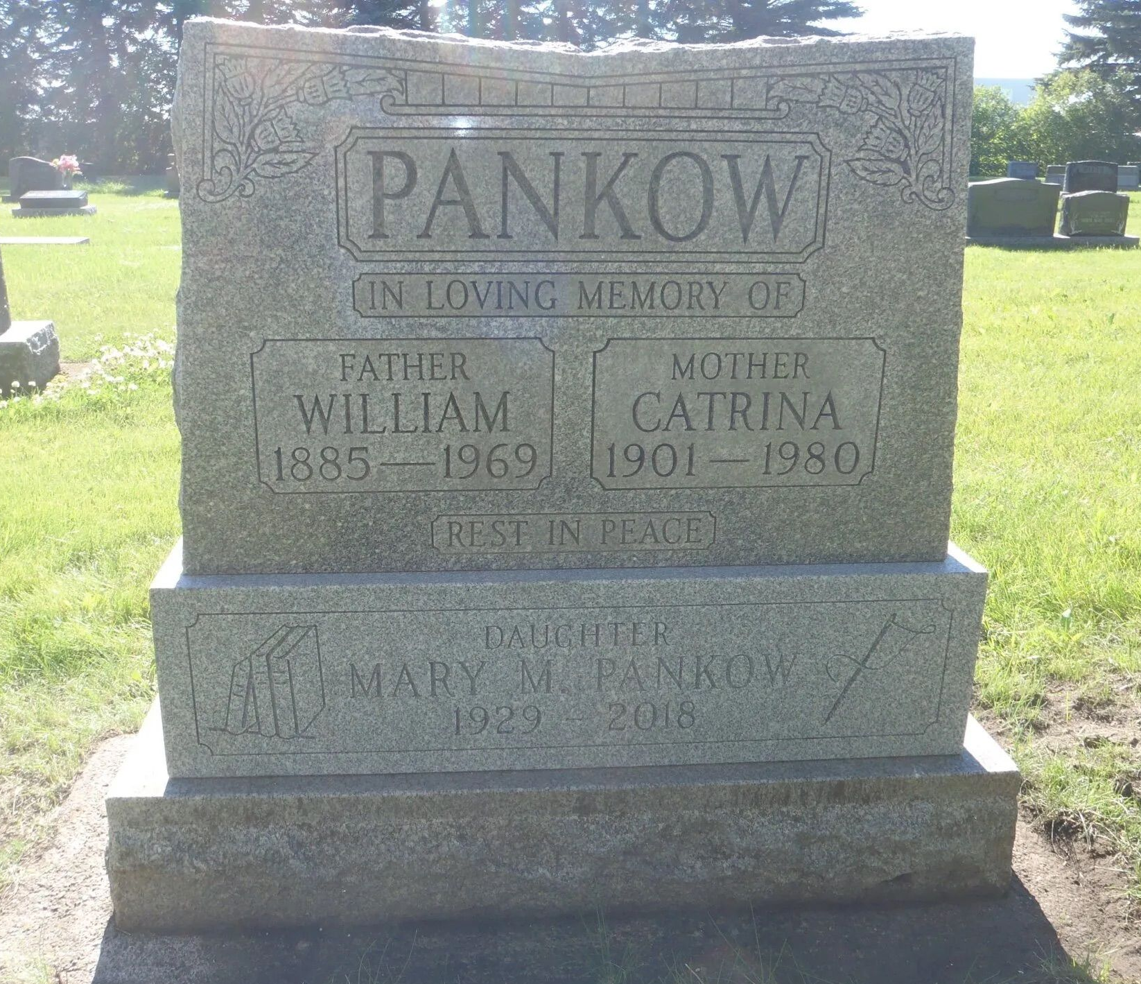 Pankow family gravestone in a sunny cemetery, with engraved names and dates.