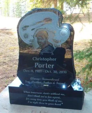 Black gravestone memorial with a football helmet engraving and the name Christopher Porter.