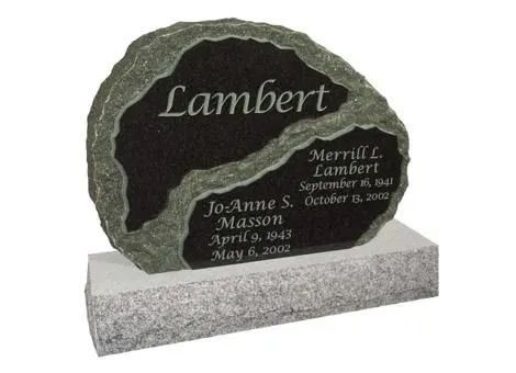 Black-and-gray granite gravestone on a base, engraved with the name “Lambert” and smaller memorial inscriptions.