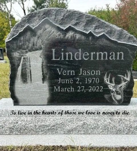 Gravestone with deer etching, name Linderman, dates June 2, 1970–March 27, 2022, and an inscription.