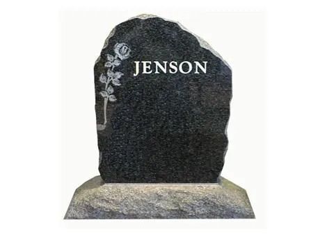 Black granite headstone with “JENSON” engraved, mounted on a light stone base.