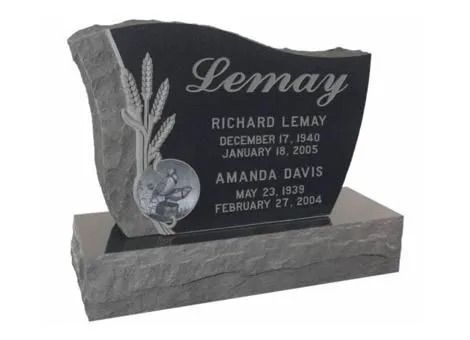 Black granite memorial headstone with engraved floral design and gold lettering on a base.