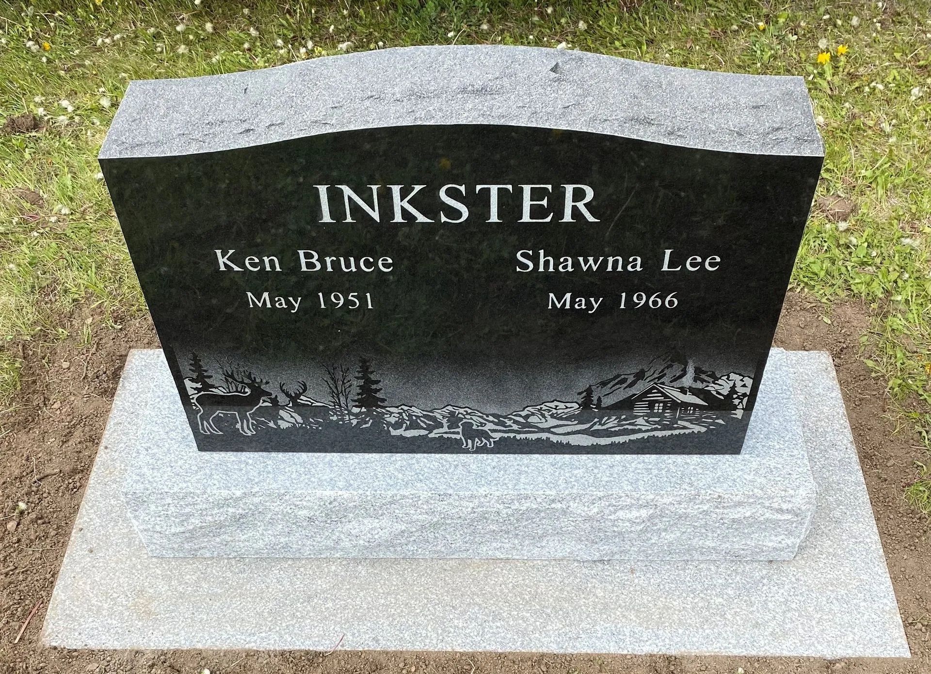 Black granite gravestone engraved “INKSTER,” with two names and dates on a concrete base.