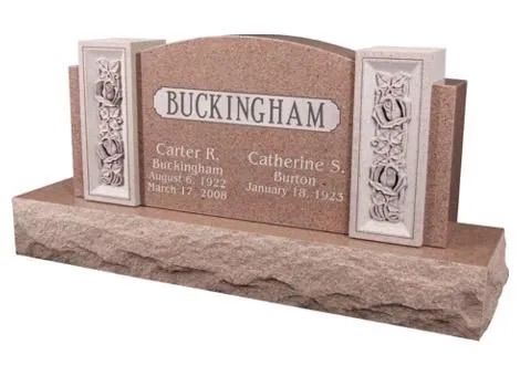 Buckingham memorial headstone with engraved names and decorative stone panels on a base