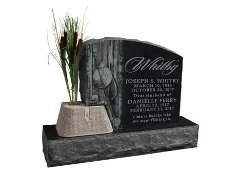 Black granite memorial headstone with engraved names and a flower vase on the left