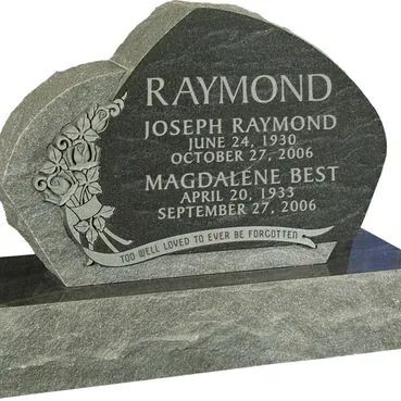 Gray heart-shaped gravestone with floral engraving and engraved names Raymond, Joseph Raymond, and Magdalene Best