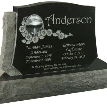 Black polished memorial headstone with floral engraving and the name Anderson