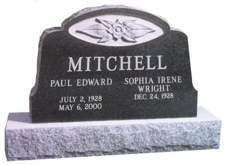 Black granite gravestone with white engraved names and dates, topped by an oval floral emblem.