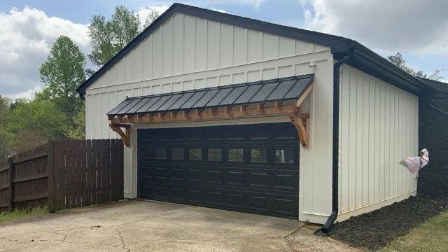 A detached garage with an eyebrow