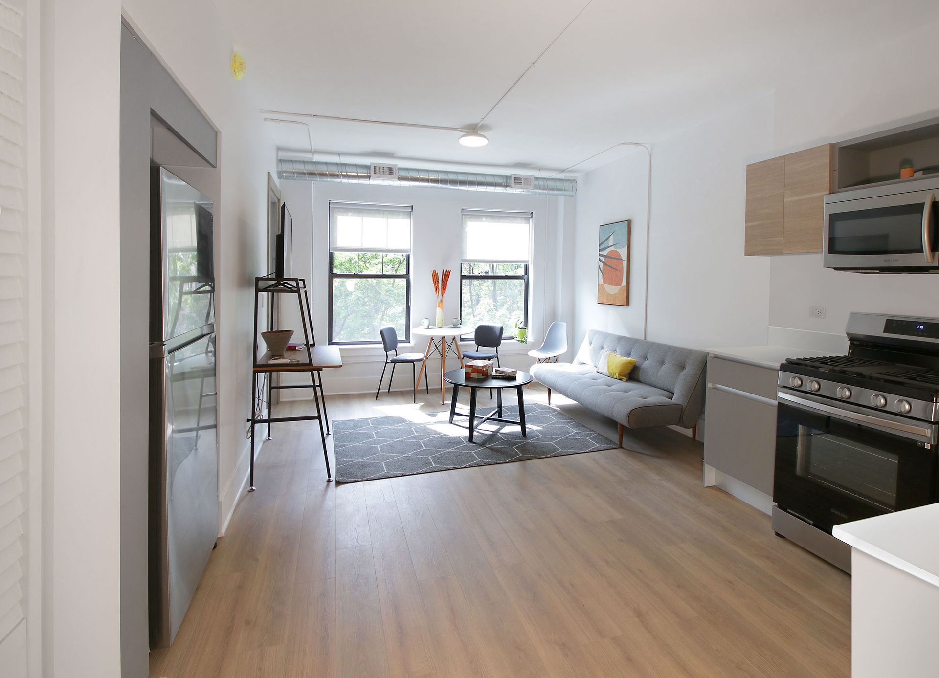 A living room with a couch and a stove in it
