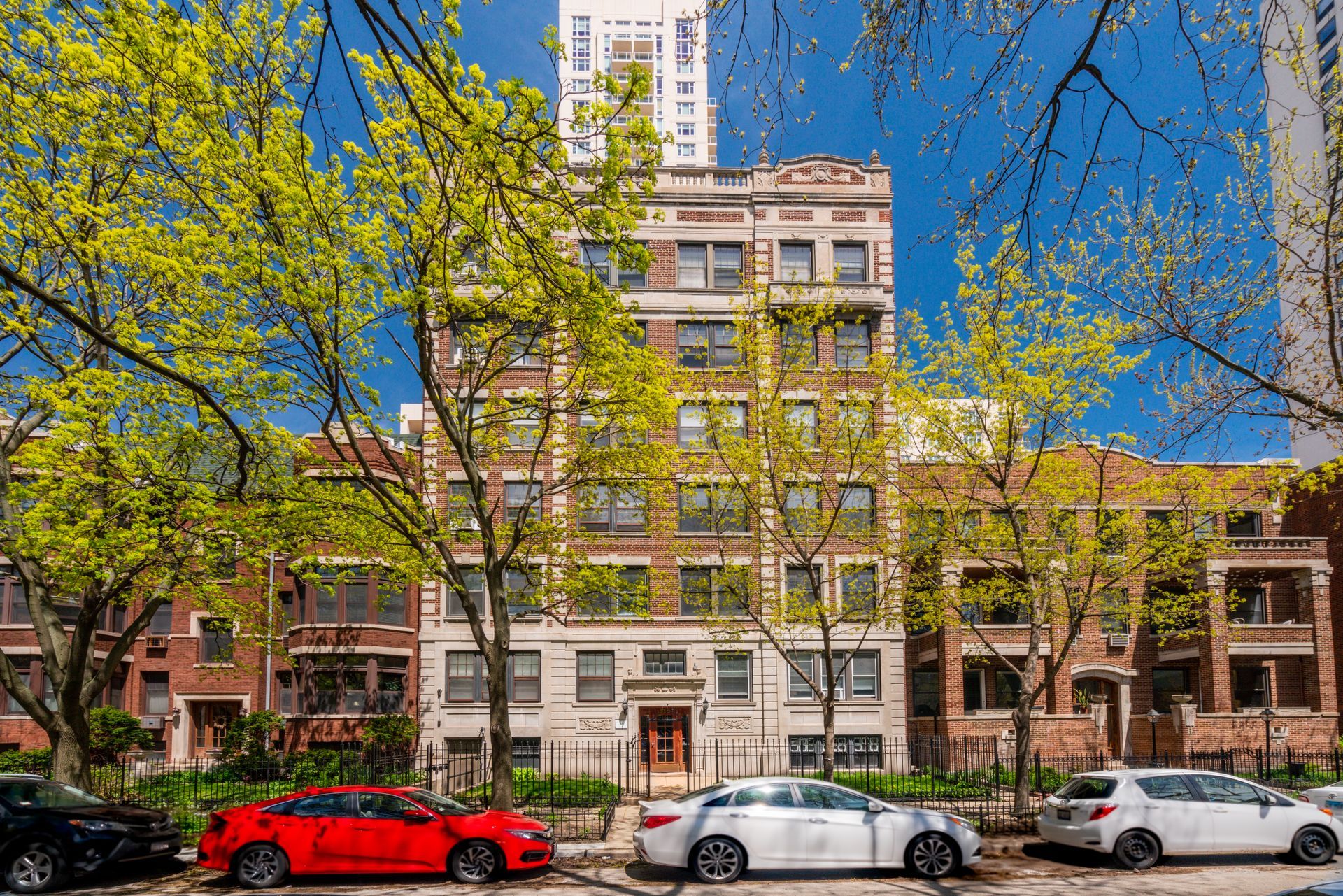 A building with a lot of cars parked in front of it