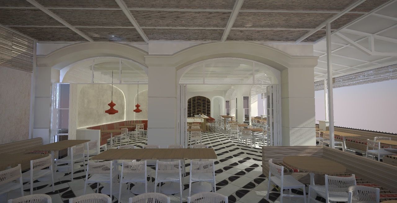 Bright café interior with white chairs, arched mirrors, and red pendant lights