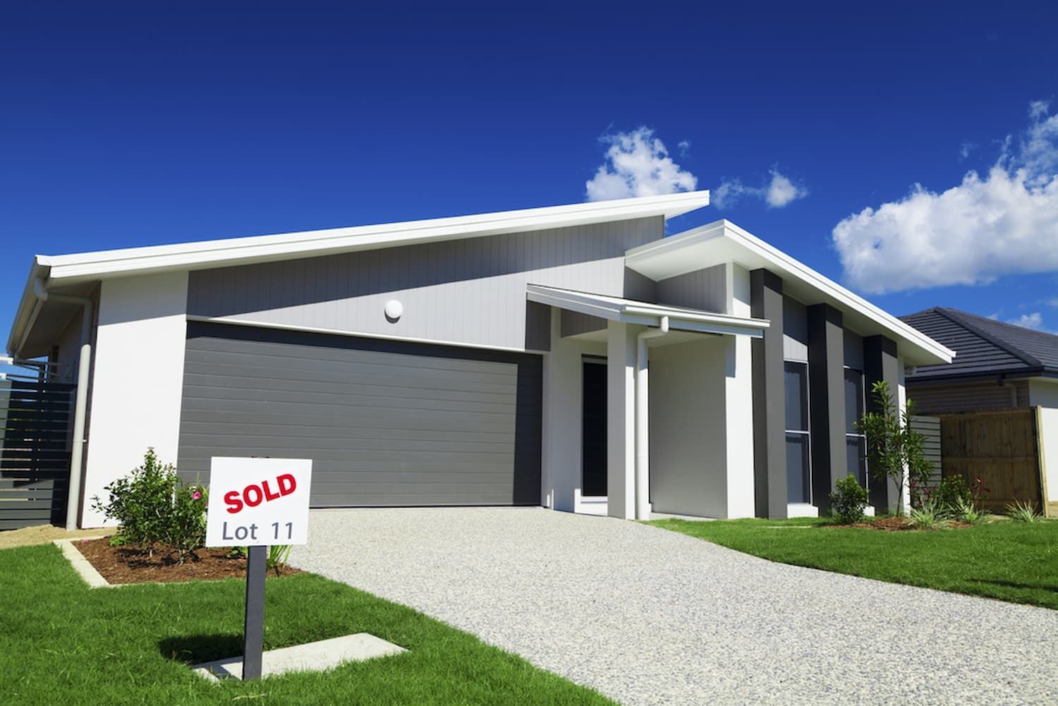 A House With A Sold Sign in Front of It — Cairns Property Collective in Edge Hill, QLD