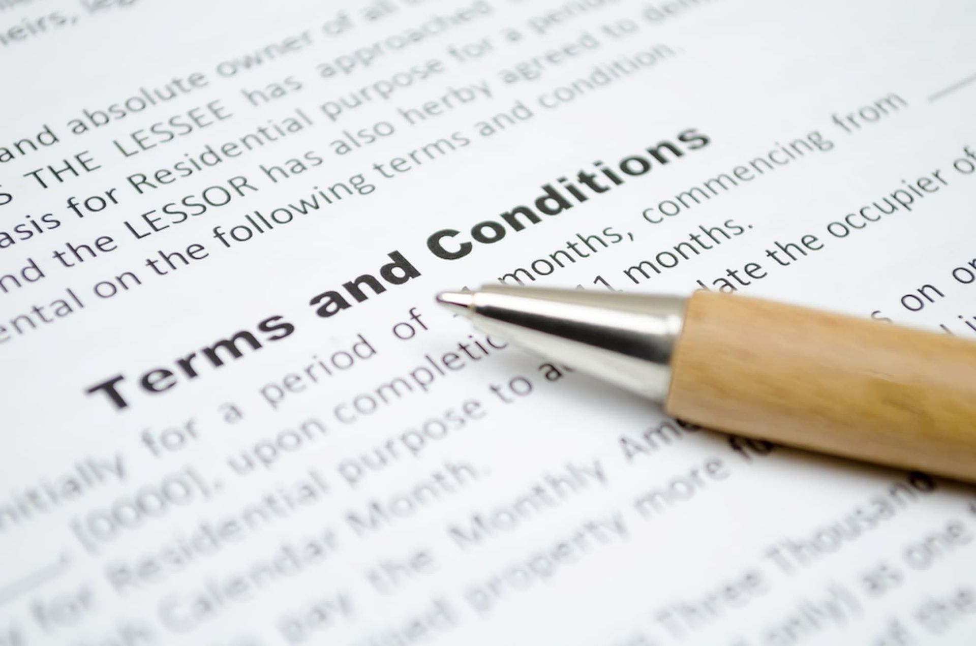 A Pen Rests on A Piece of Paper that Says Terms and Conditions — Cairns Property Collective in Trinity Park, QLD