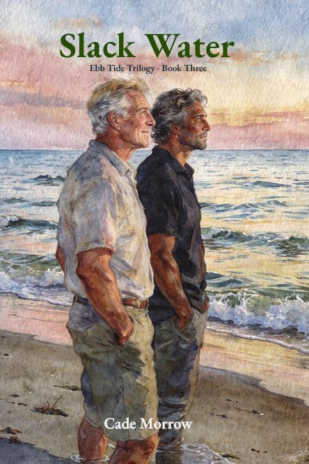 Two men stand on a beach at sunset, facing the ocean, 