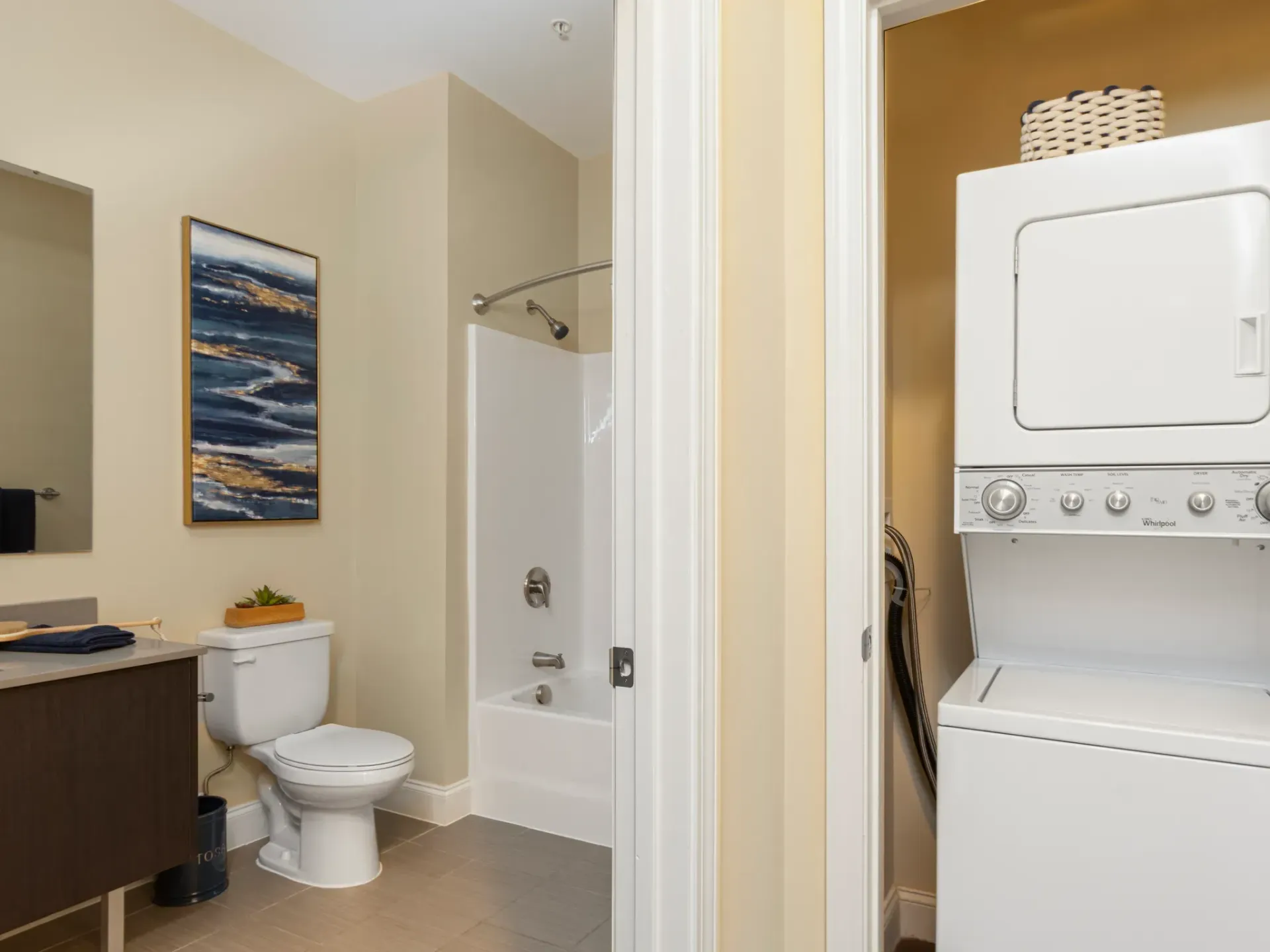 Apartment bathroom with washer and dryer at Wellington Parkside.
