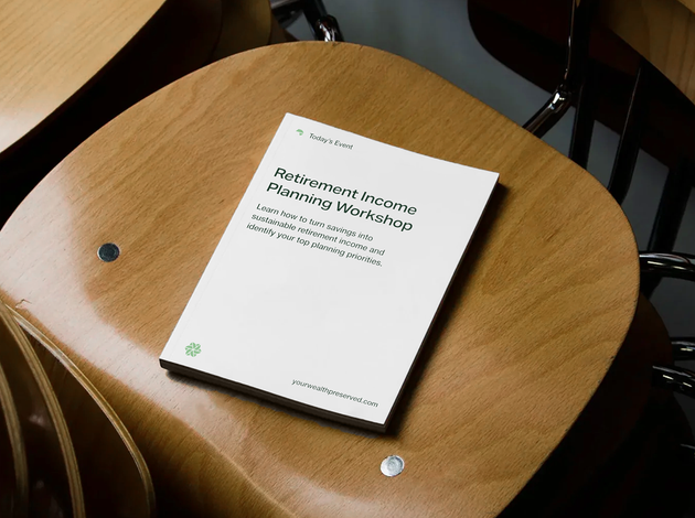 White booklet on a wooden chair seat with metal bolts, viewed from above.