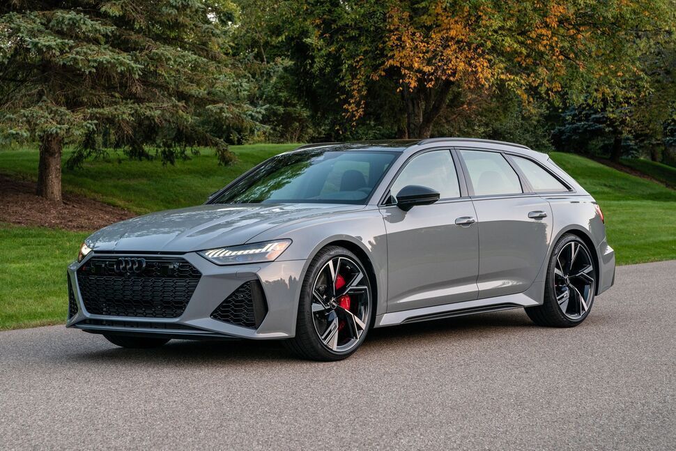 A gray audi rs6 avant is parked on the side of a road.