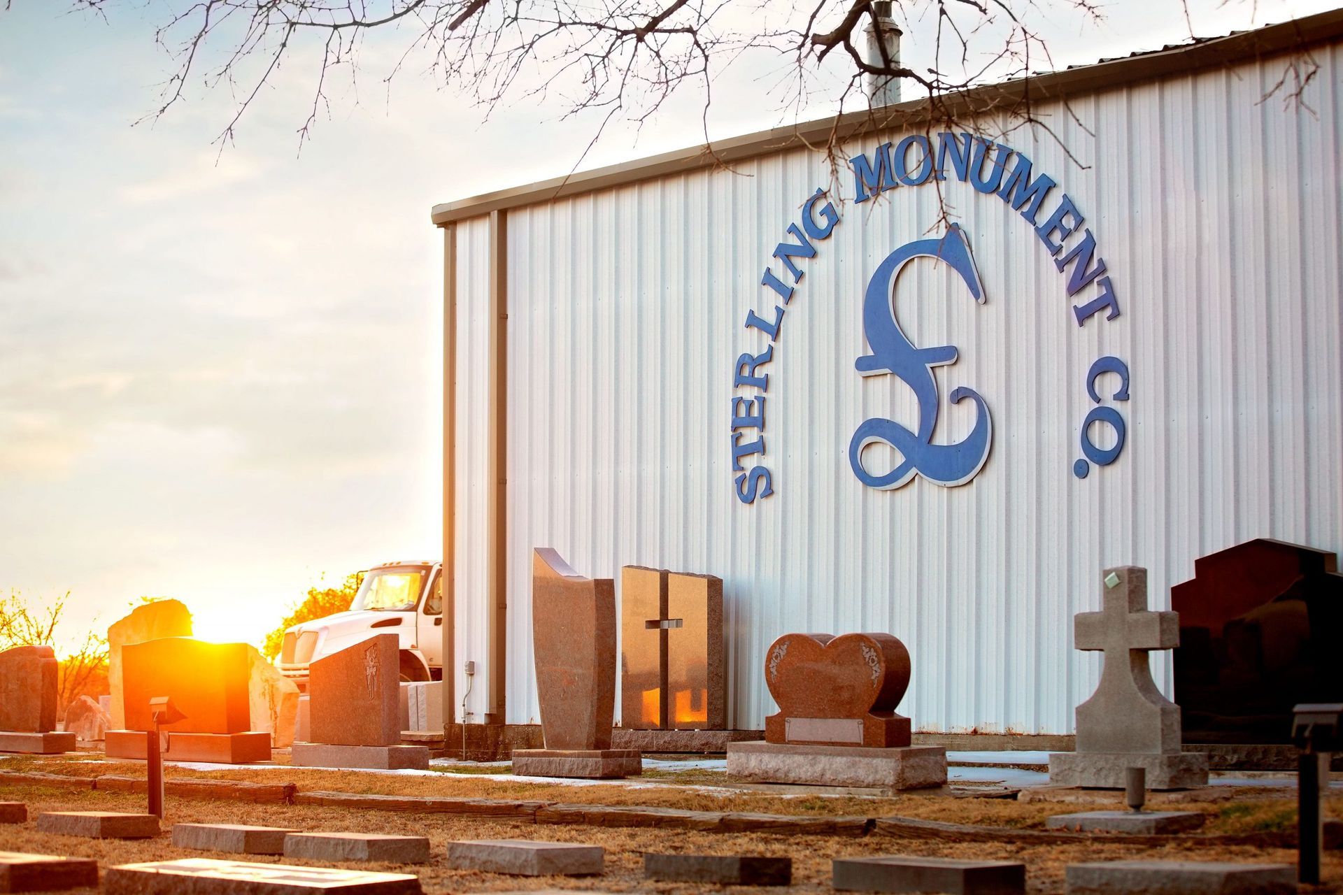 A cemetery with a building that says sterling monument co.