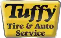 Tuffy Tire & Auto Service logo on a yellow sign with black lettering