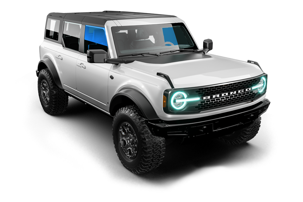 Silver off-road SUV with black trim and teal headlights on a white background