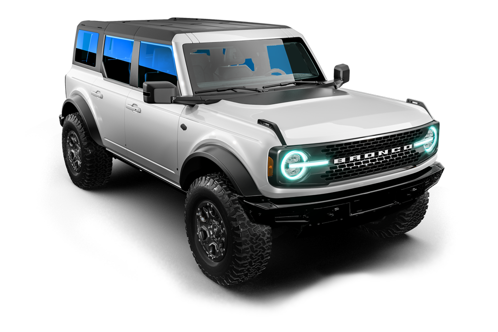 Silver off-road SUV with black trim and teal headlights on a white background