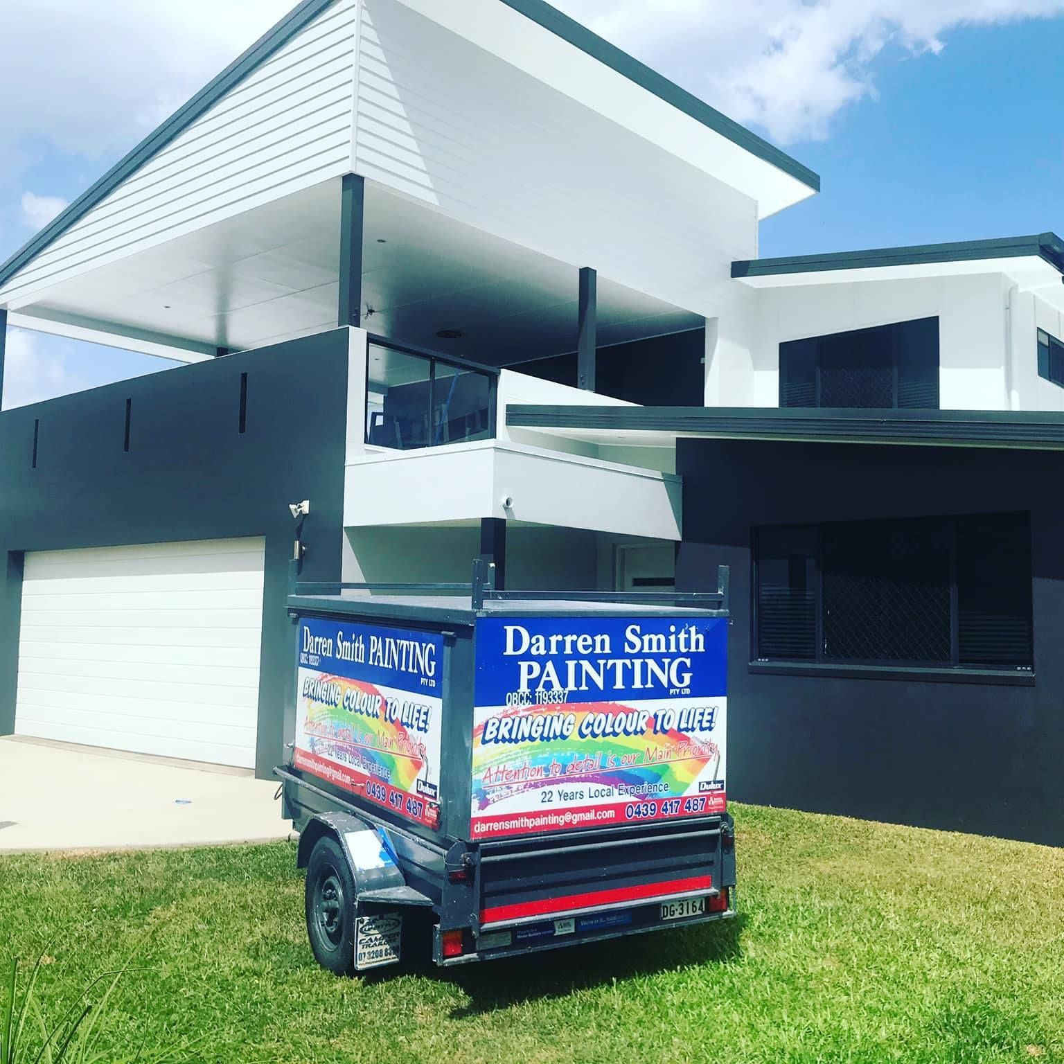 A Trailer for Darren Smith Painting Is Parked in Front of A House — Darren Smith Painting Pty Ltd in Rural View, QLD