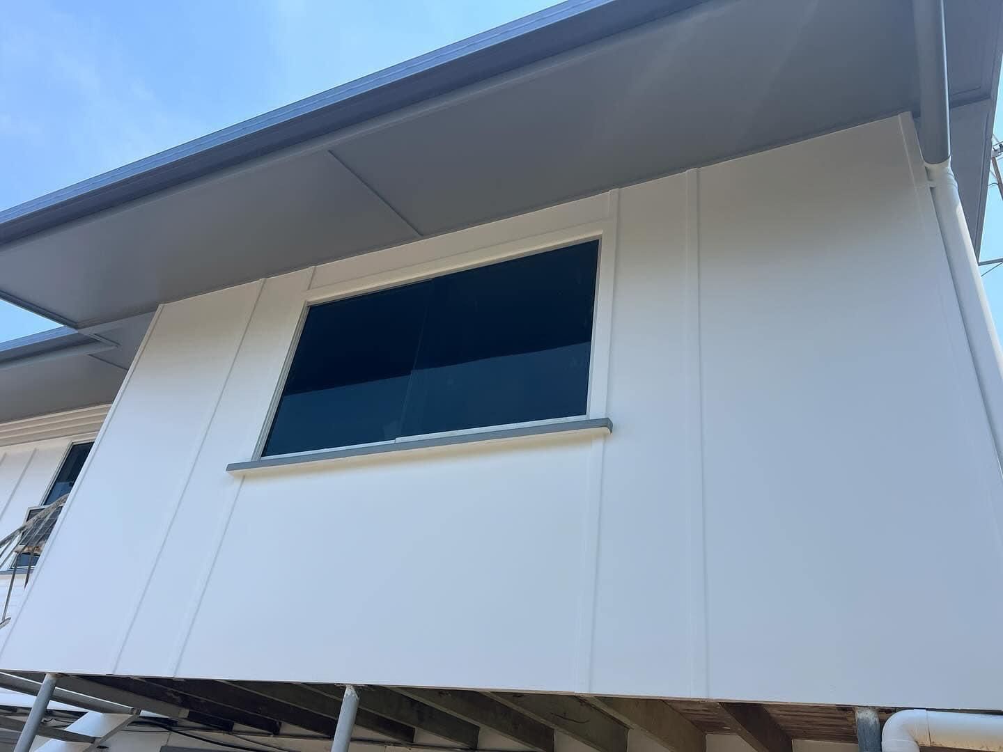 A White House with A Window on The Side of It — Darren Smith Painting Pty Ltd in Mackay, QLD