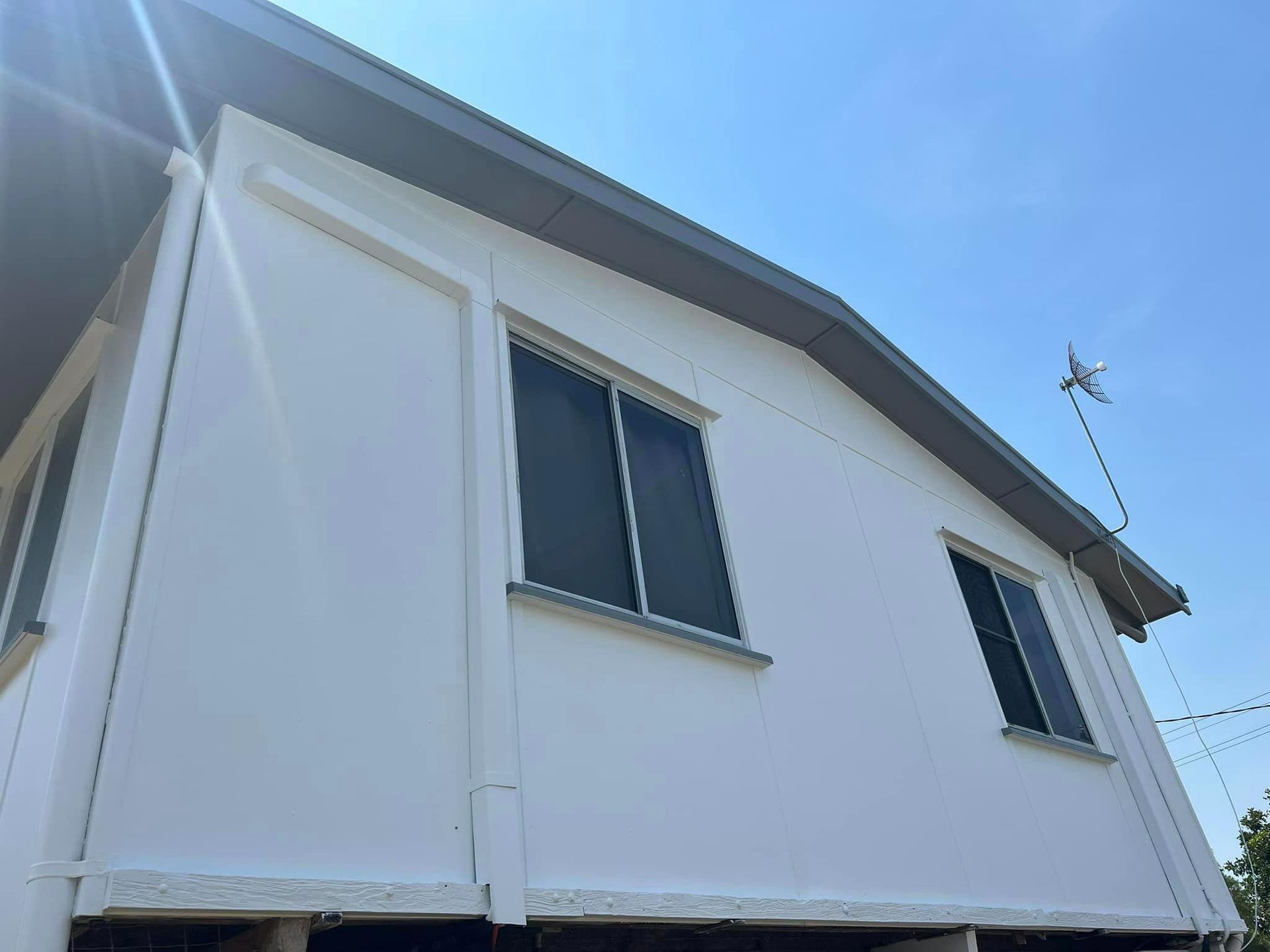 A White House with A Blue Sky in The Background — Darren Smith Painting Pty Ltd in Mirani, QLD