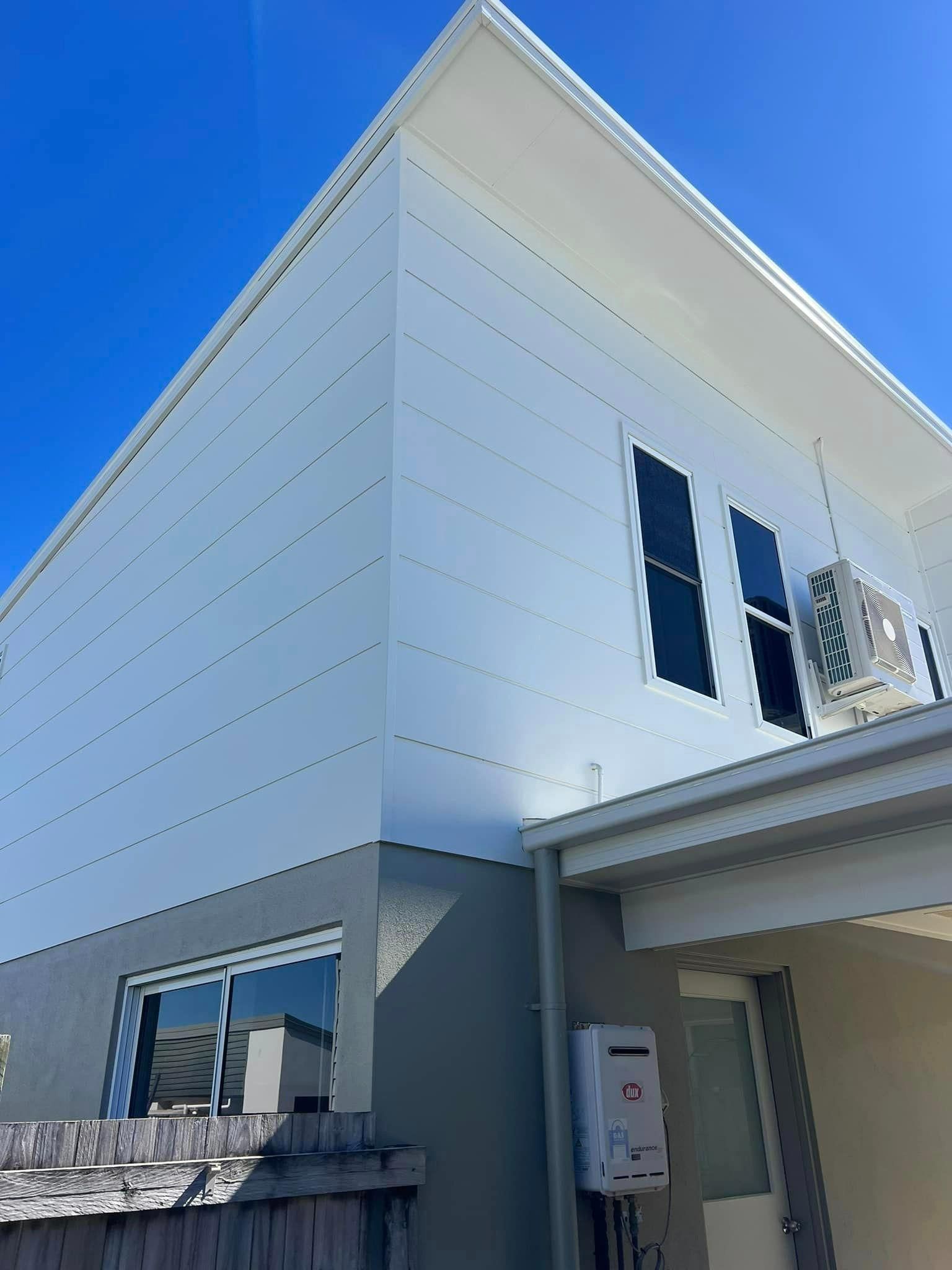 A White House with A Blue Sky in The Background — Darren Smith Painting Pty Ltd in Sarina, QLD