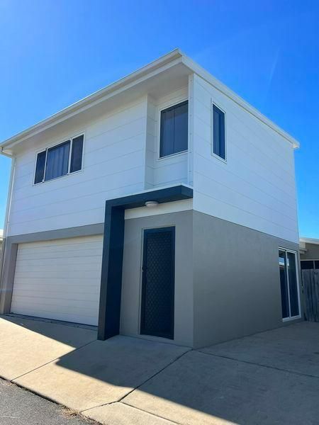 A White House with A Garage and A Blue Sky in The Background — Darren Smith Painting Pty Ltd in Rural View, QLD