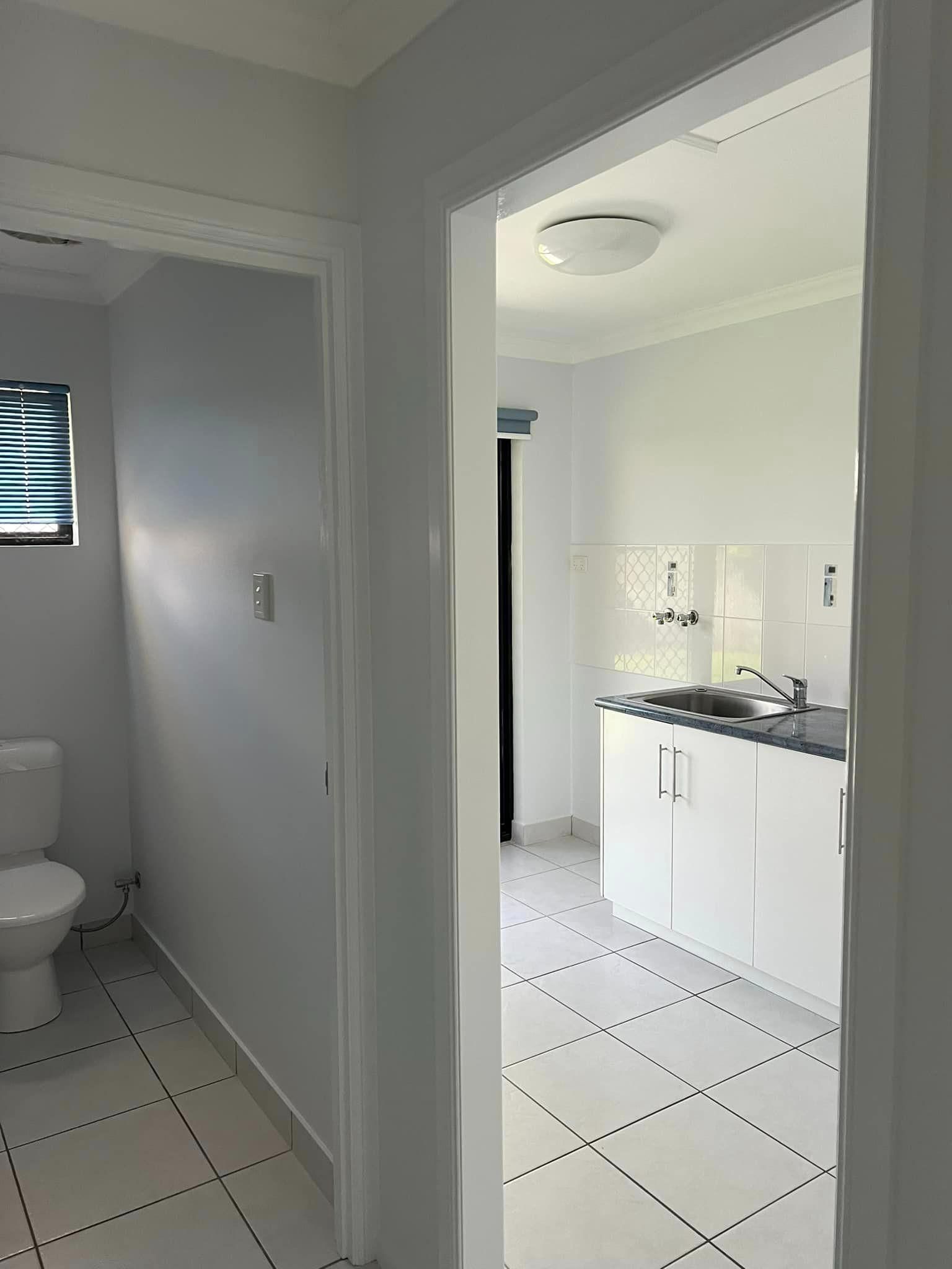 A Bathroom with A Toilet and A Sink in A House — Darren Smith Painting Pty Ltd in Rural View, QLD