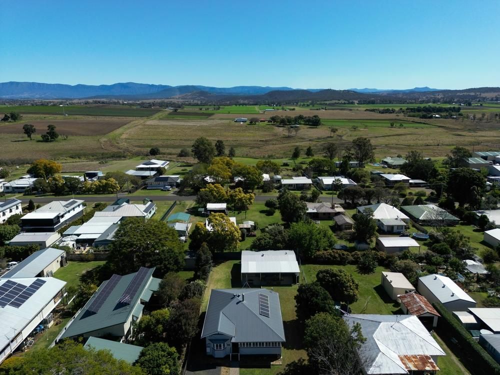 An Aerial View of A Residential Area with Lots of Houses and Trees — Darren Smith Painting Pty Ltd in Rural View, QLD