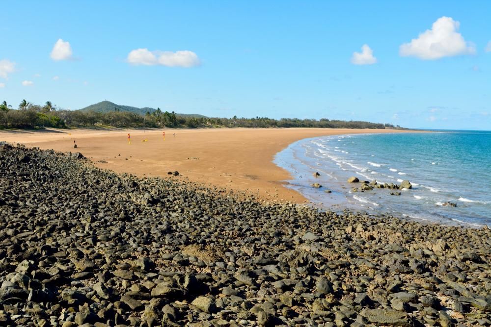 A Rocky Beach with A Large Body of Water in The Background — Darren Smith Painting Pty Ltd in Sarina, QLD