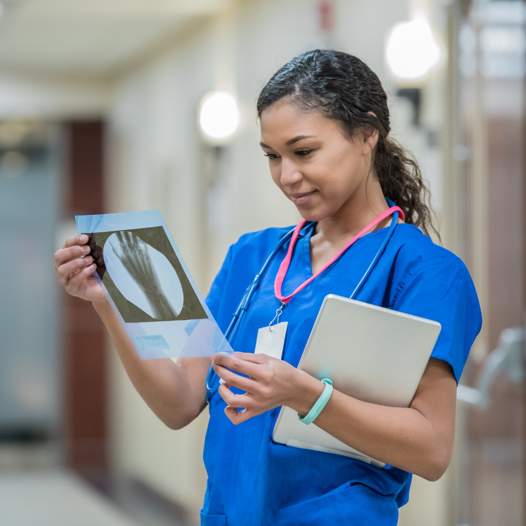 nurse looking at xray