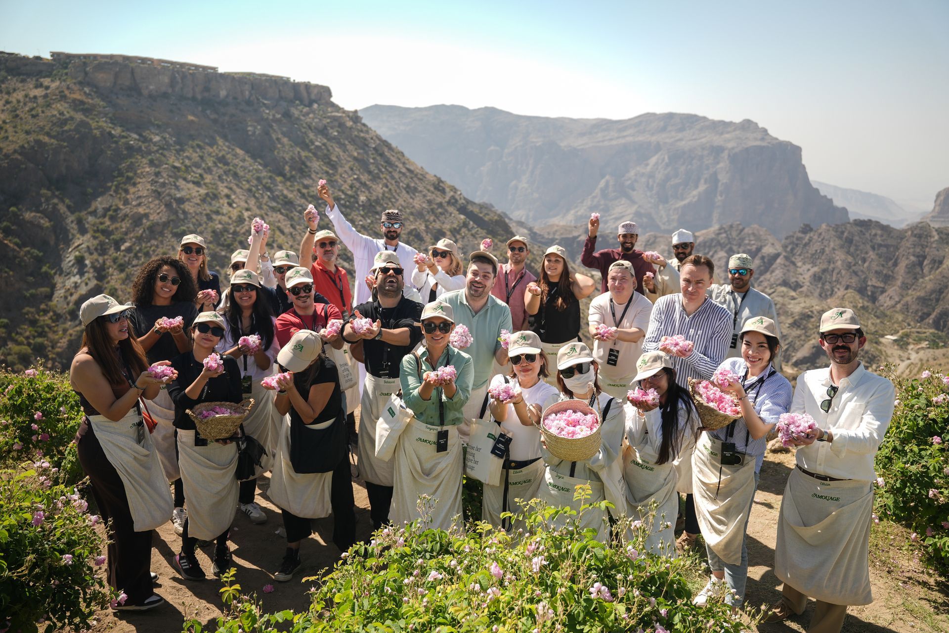 Amouage team group photo with rose baskets in Jabal Akhdar