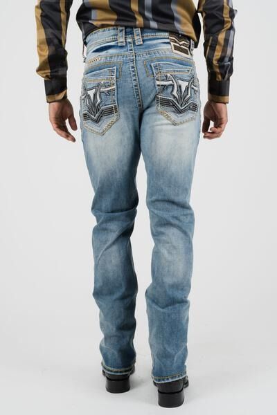 Back view of light blue jeans with decorative back pockets and dark boots