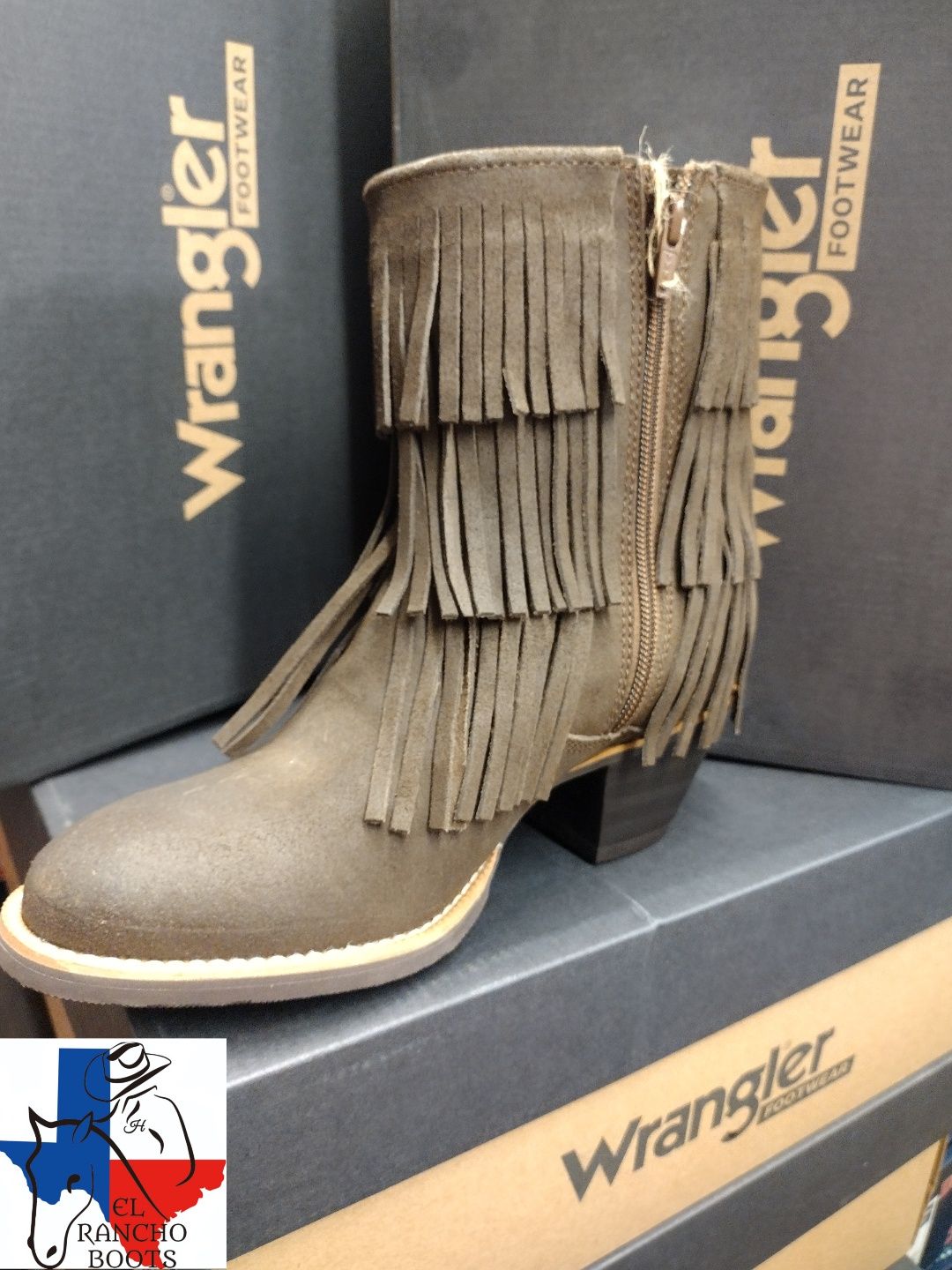 Brown fringed Wrangler ankle boots on a box display