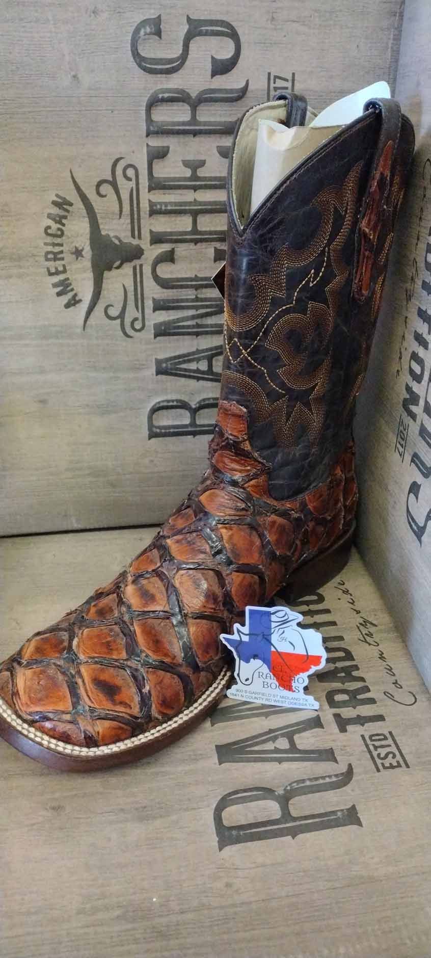 Brown western cowboy boot with Texas flag emblem, displayed in a boot box.